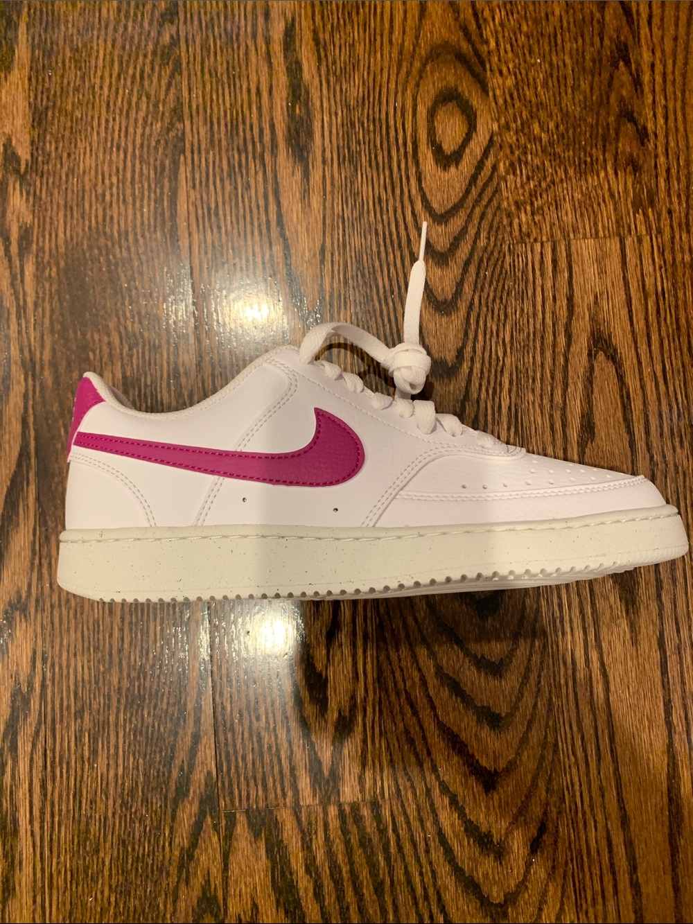 Nike White Low-Top Sneakers with Purple Swoosh and Heel Tab